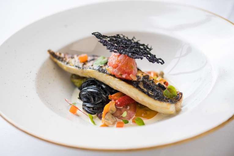 Mackerel with squid ink linguini, marinated tomato sorrel and clams